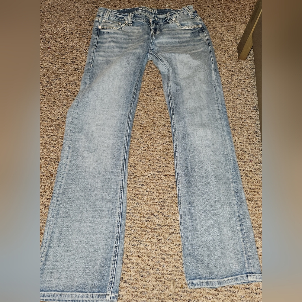 Rock and roll cowgirl riding jeans
